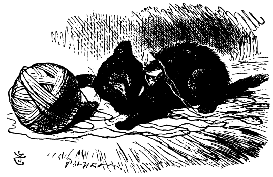A black kitten is playing with a ball of yarn.