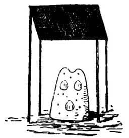 A hollow clay pillar, IKO, at OKPWEBO, with three Achatena shells inserted in it